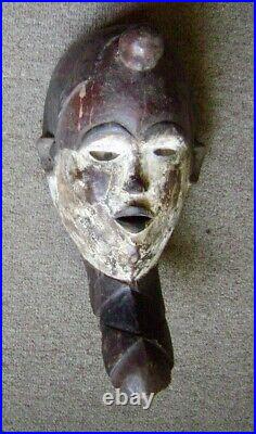 Vintage Punu mask, Gabon, Africa, wood and pigments, glass eyes